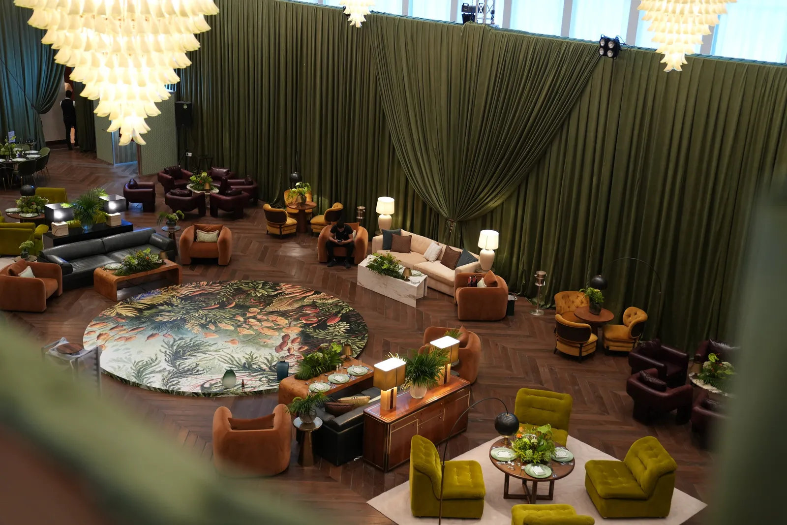 The lobby, its round bar, grand piano and patterned marble floors
