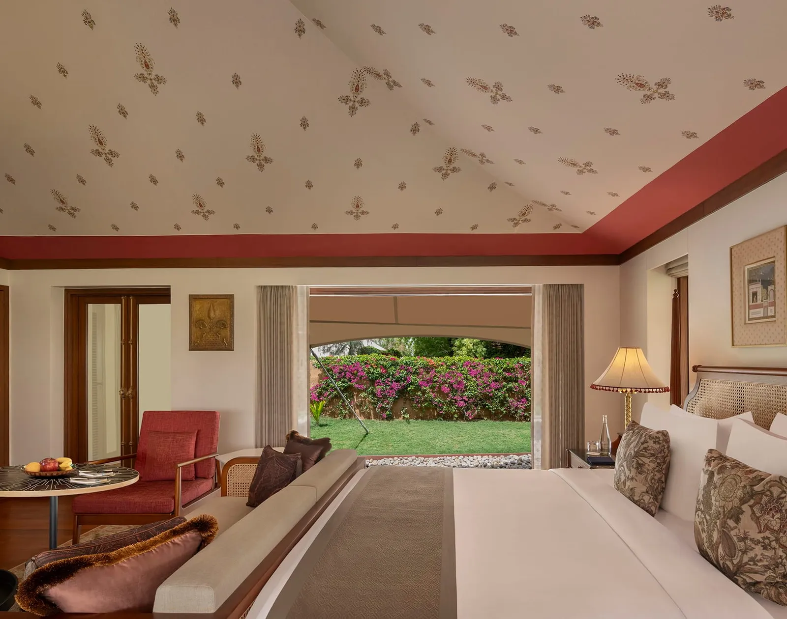 Inside a Luxury Tent, its painted canvas ceiling and glass wall onto the garden