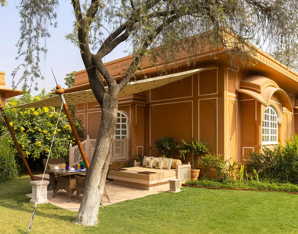 A Premier Room’s private garden, with the daybed under its awning