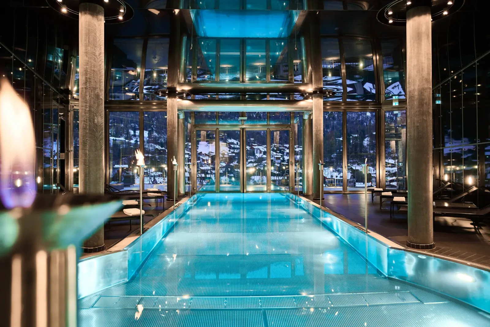 The pool between glass walls and columns