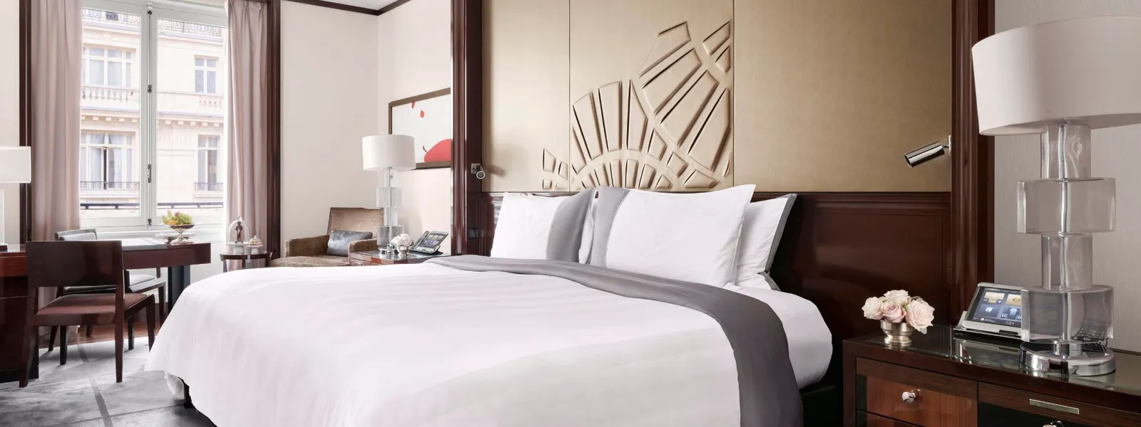 Premier Room with a double bed and a table beside the window