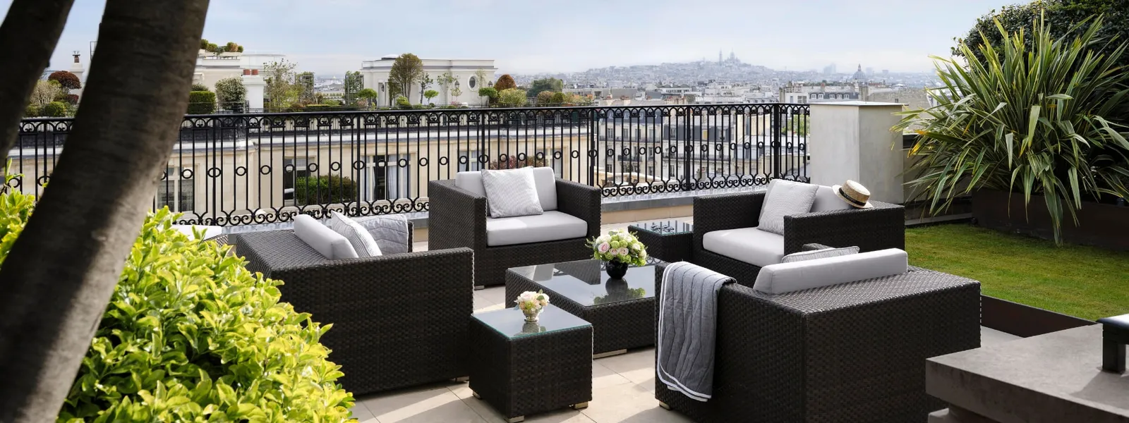 The Rooftop Garden Suite terrace with lawn, planting and outdoor furniture