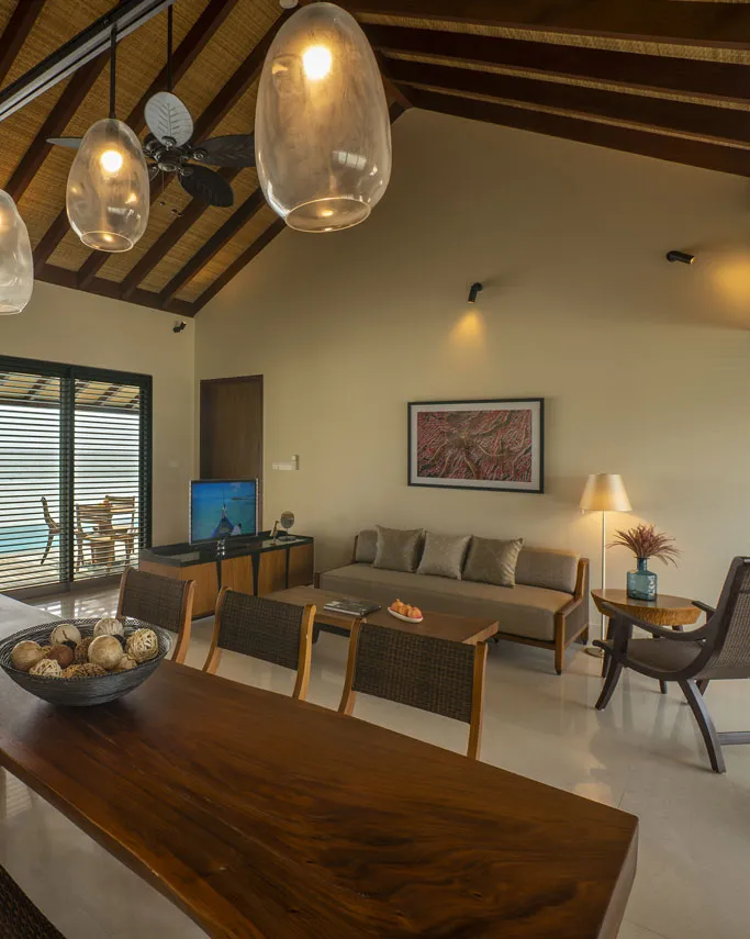 The 2-bedroom Water Pool Villa living room, with sofas and a table