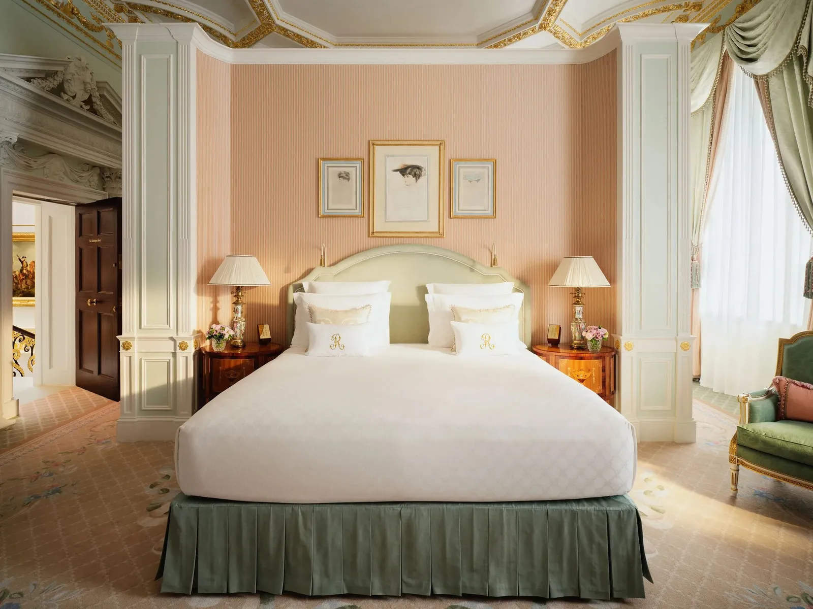 The Burlington Suite: peach walls, a bed with a sage-green valance and white columns either side