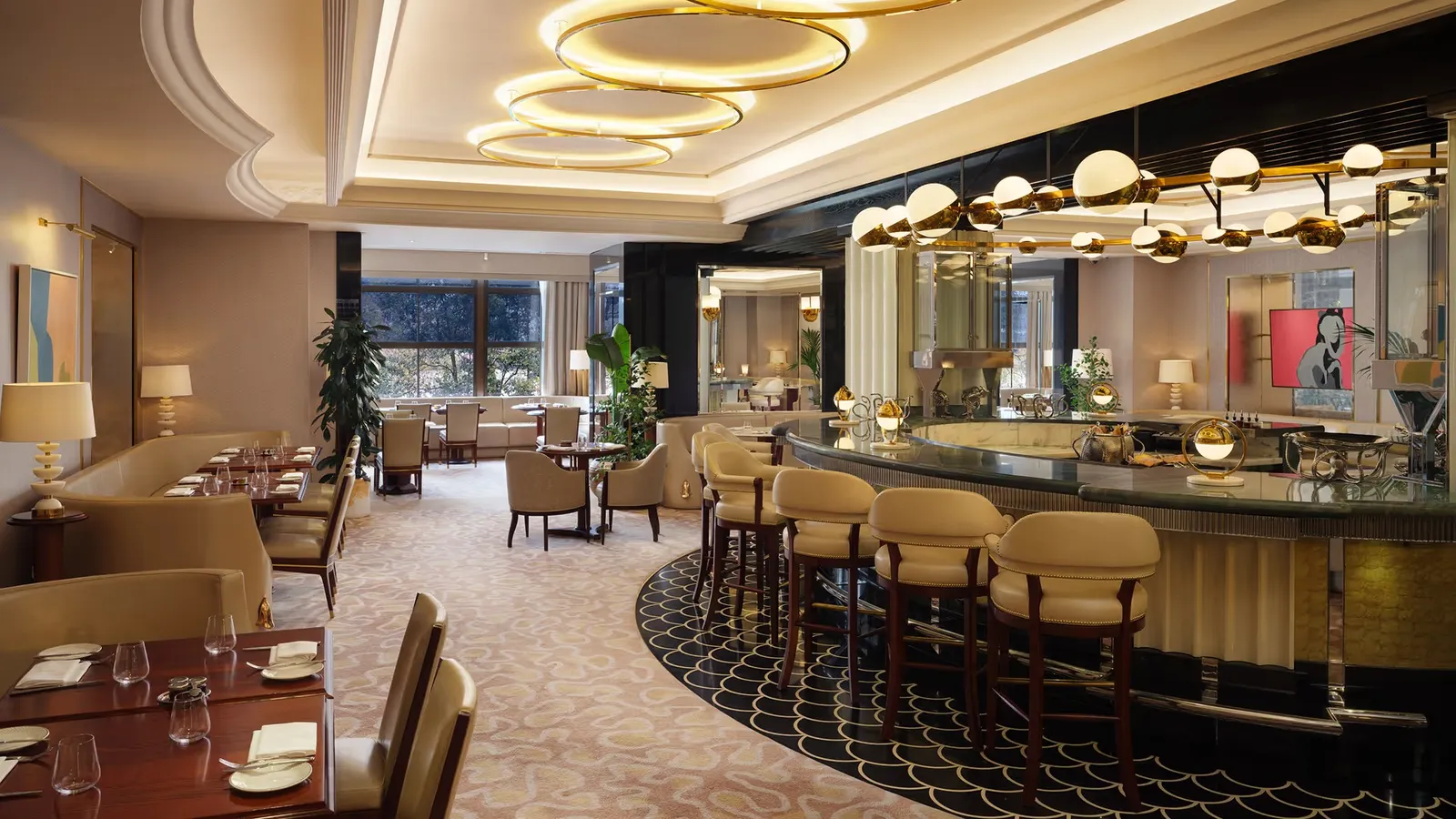 The round bar of the River Restaurant, with its stools and ring chandeliers