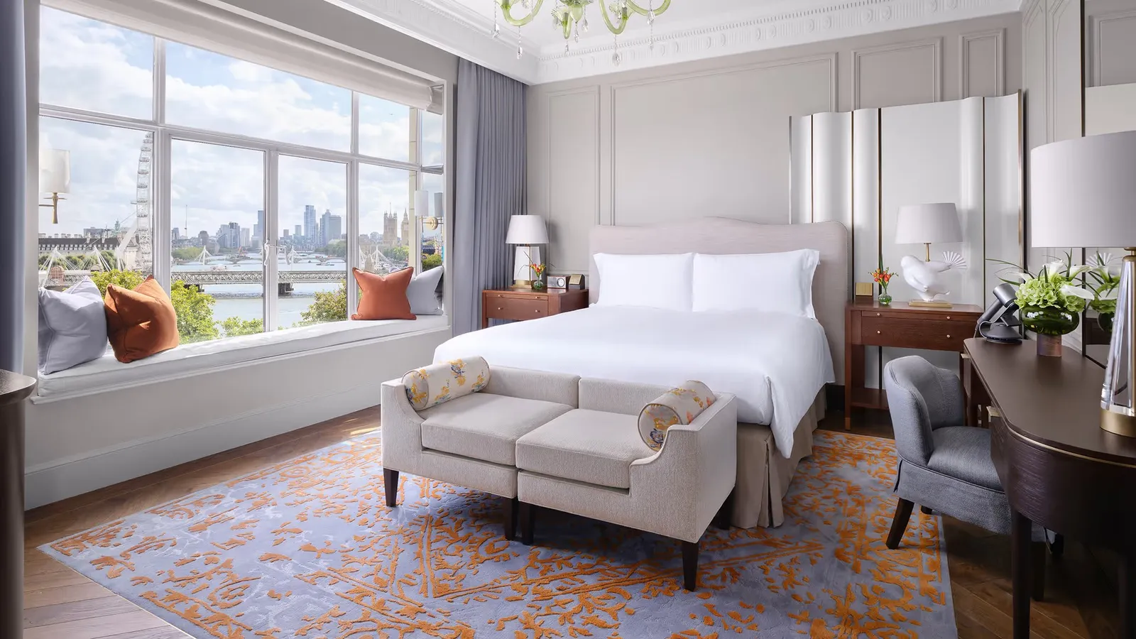 Grand River View Suite: a king bed before the windows on the Thames