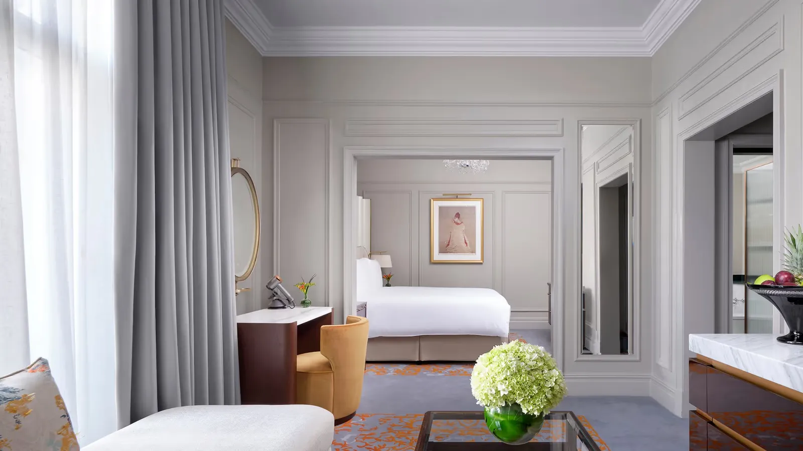 Junior Suite: the king bed beyond the sofa and armchairs