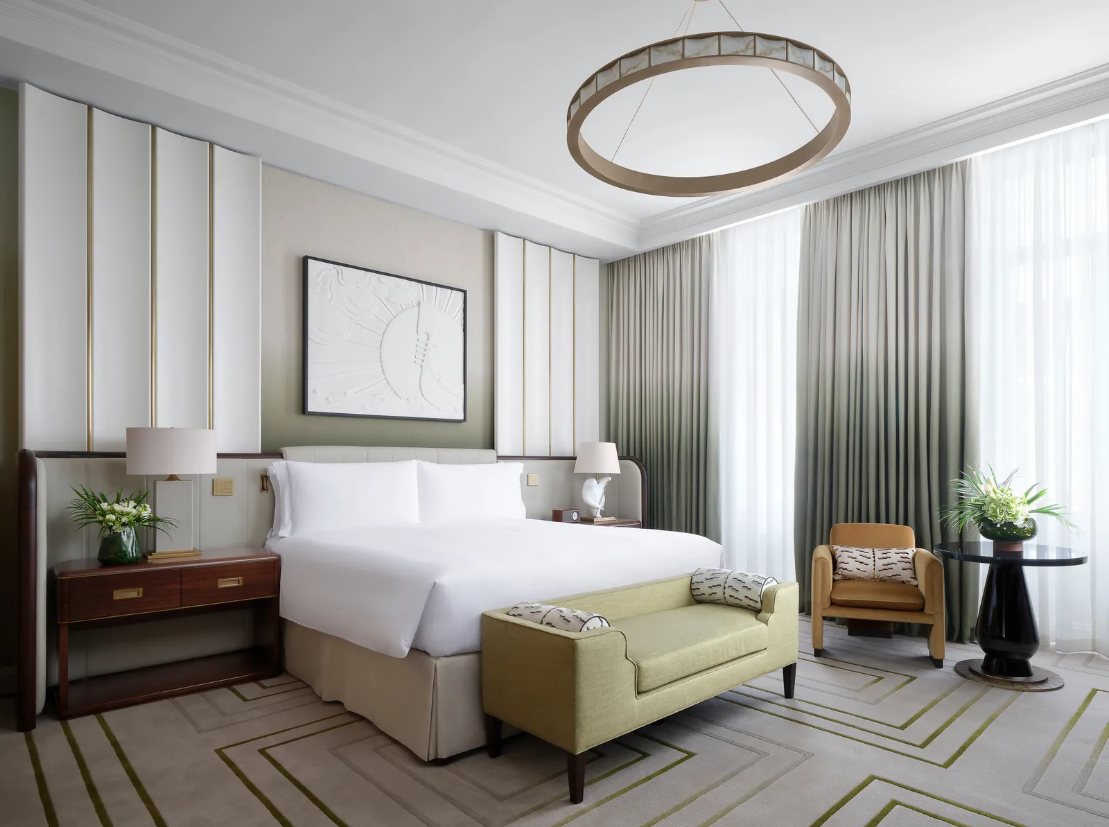 Luxury King Room: a king bed, a settee at its foot and green curtains