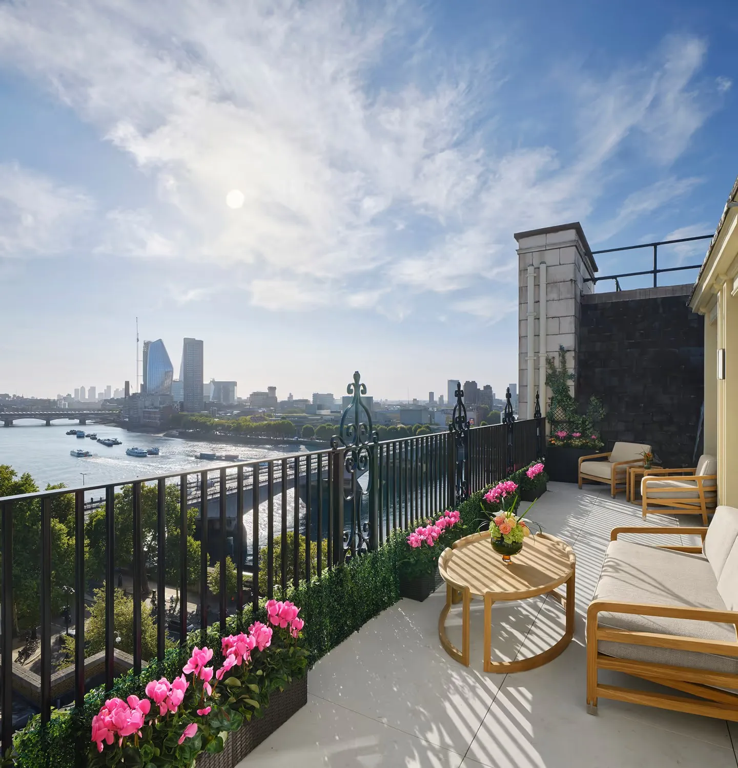 The Terrace Suite’s terrace, with flowers and the Thames below