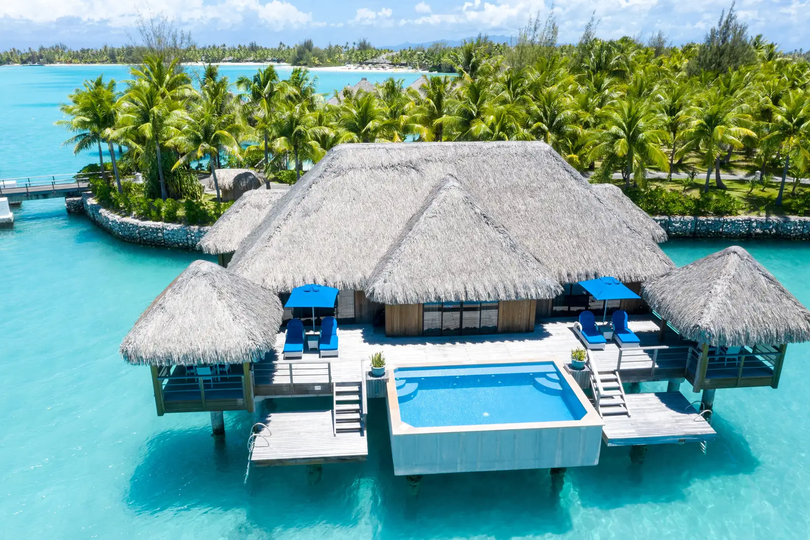 An Overwater Royal villa from above, its plunge pool on the deck