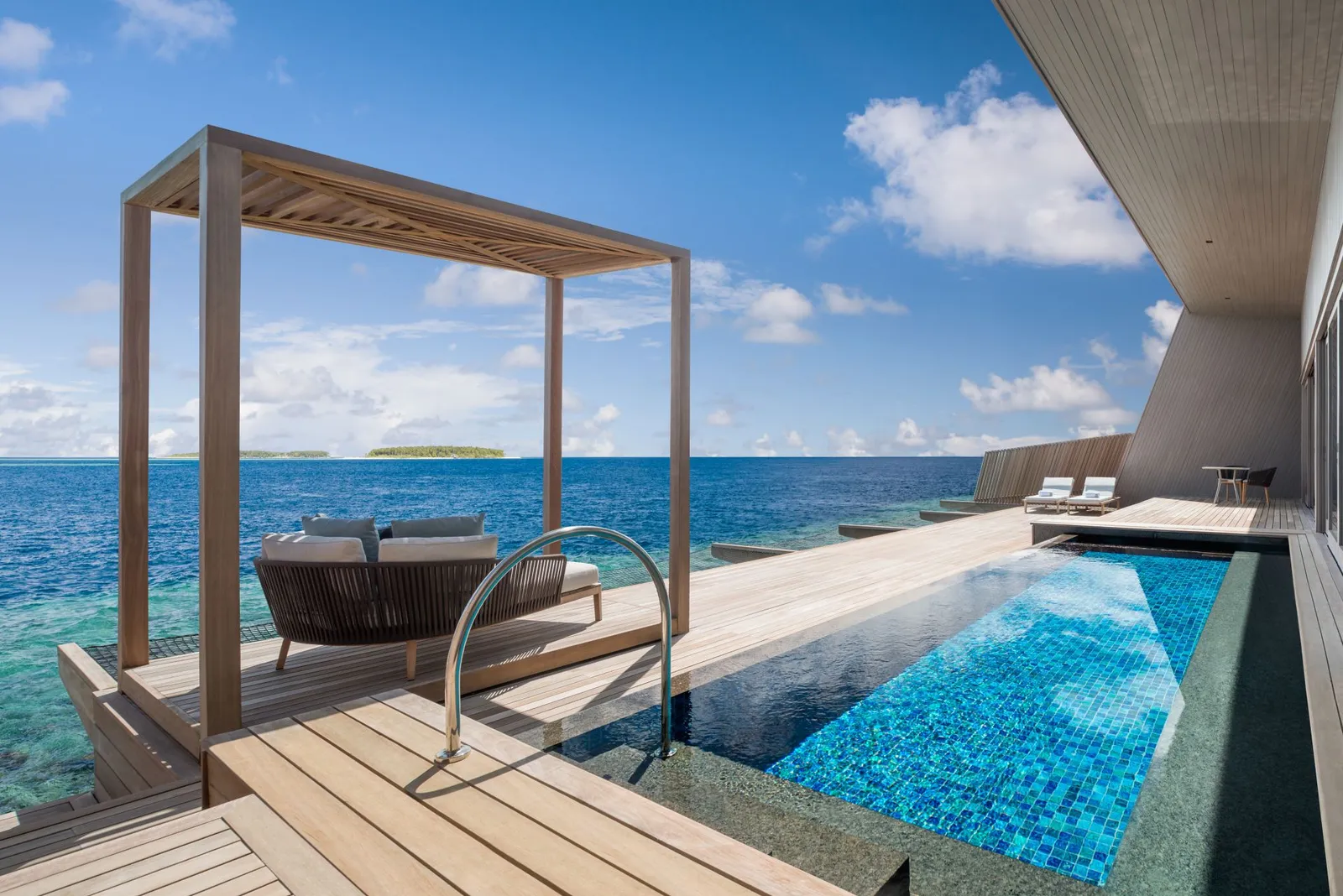 The Overwater St. Regis Suite’s pool and pergola over the sea