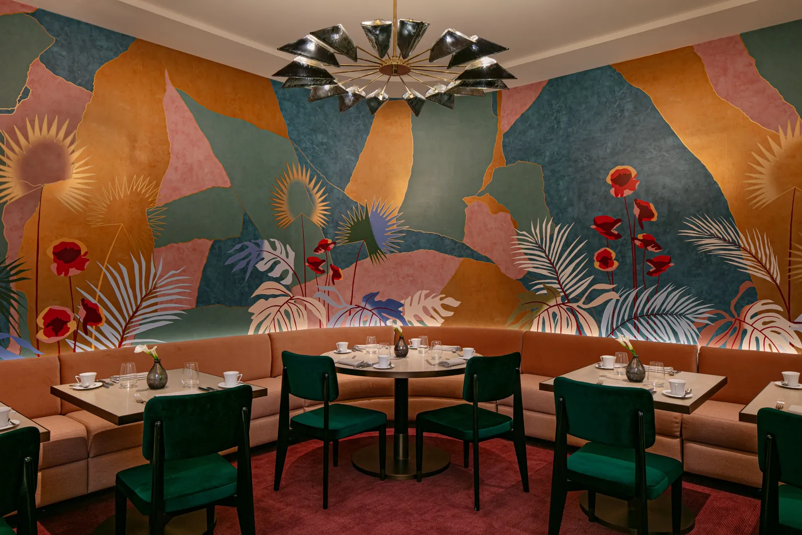 La Maisonette with its banquettes and leaf-patterned walls