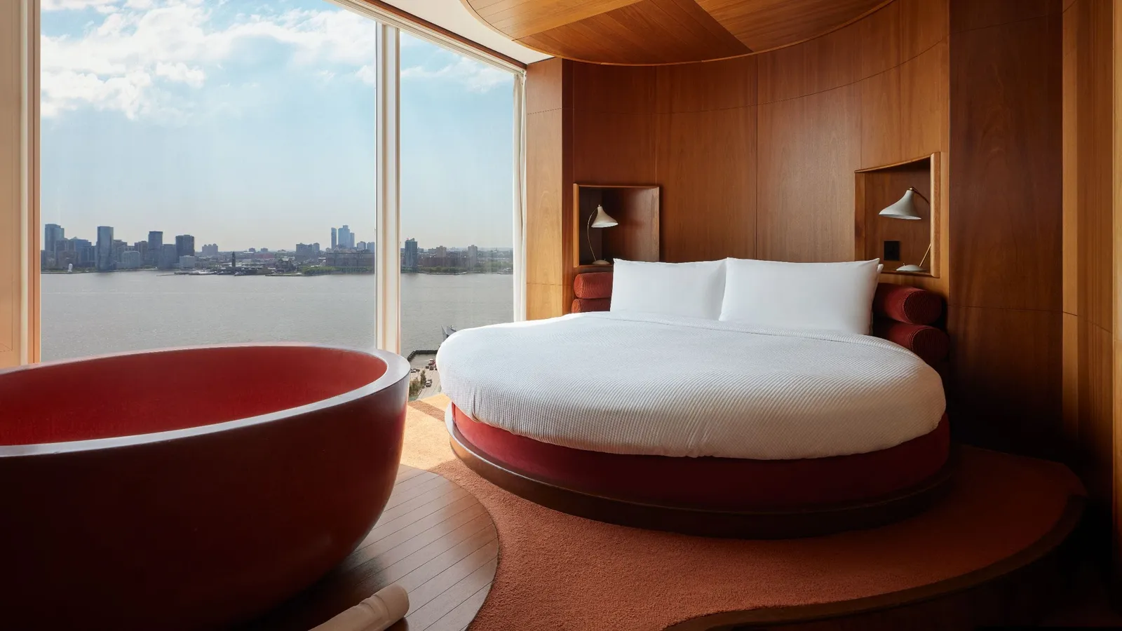 The Liberty Suite with its round bed and the red tub facing the river