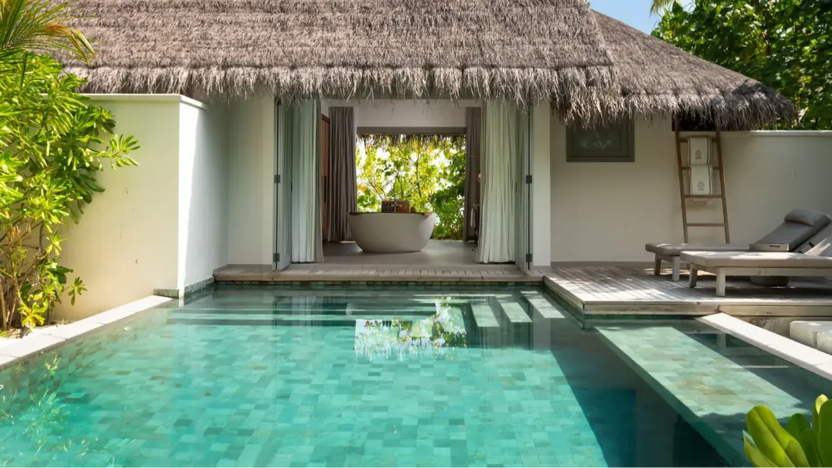 The garden pool of a One Bedroom Beach Pool Residence, the bathtub behind it.