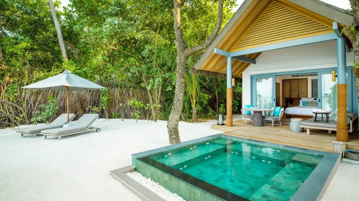 The plunge-pool Beach Villa that completes the Three Bedroom Beach Pool Residence, 2 loungers on the sand.