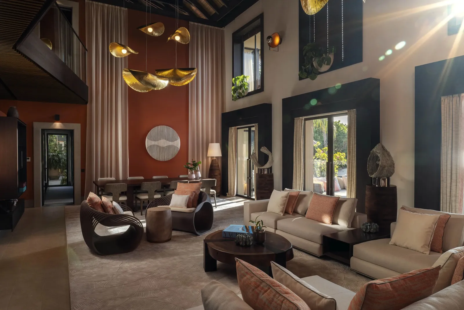 Kuredhi Residence: the double-height living room in timber and raffia