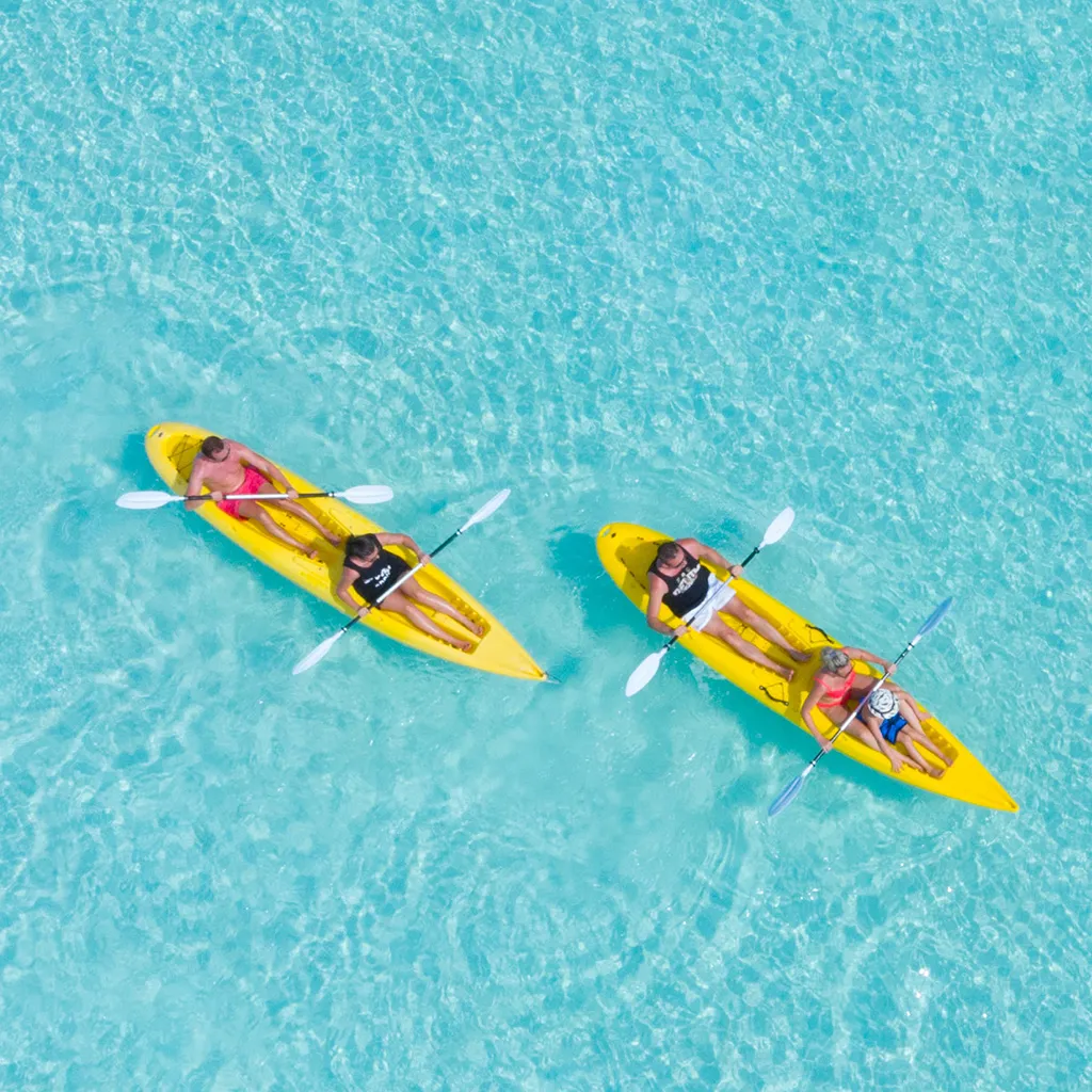 2 yellow kayaks in the lagoon, seen from above.