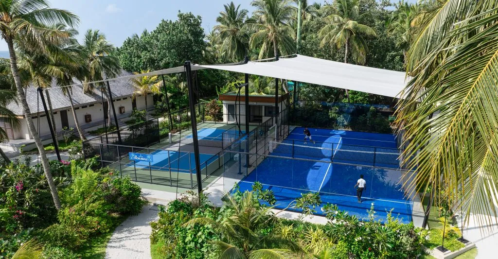The padel and pickleball courts among the palms.