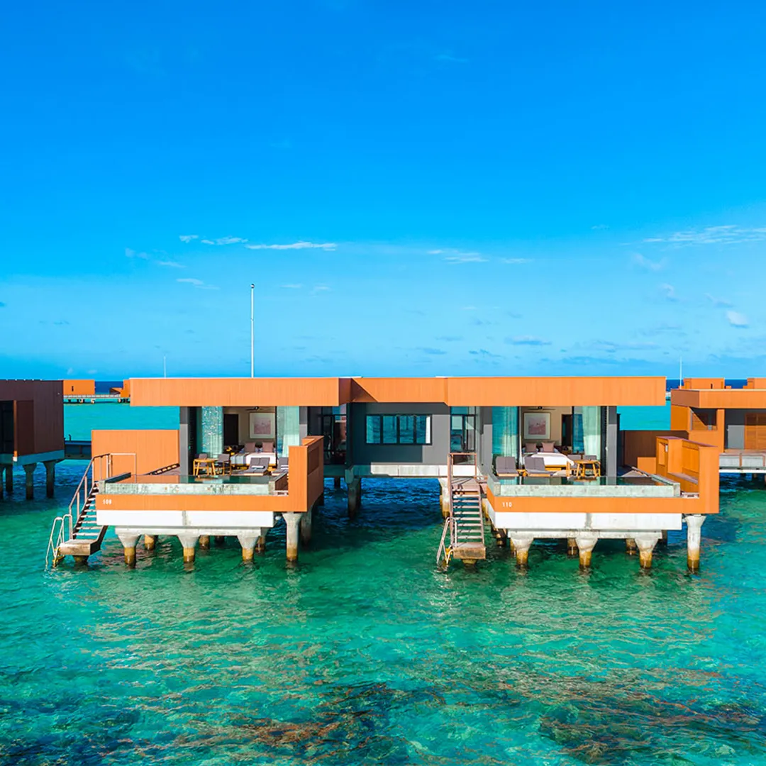 2-bedroom Ocean Pool Villas side by side over the lagoon.