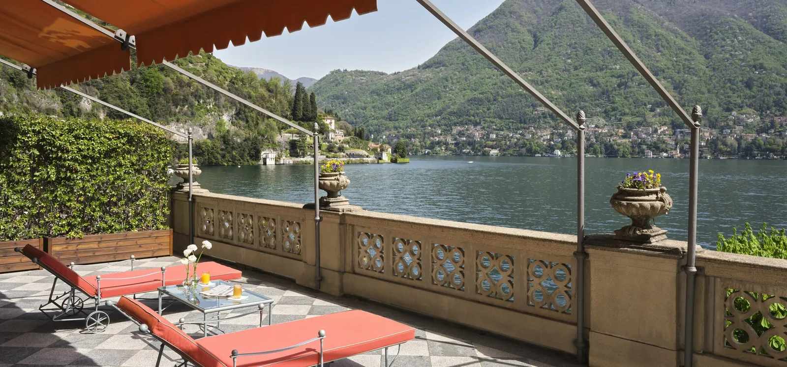 The Cardinal Suite’s terrace with loungers over the lake