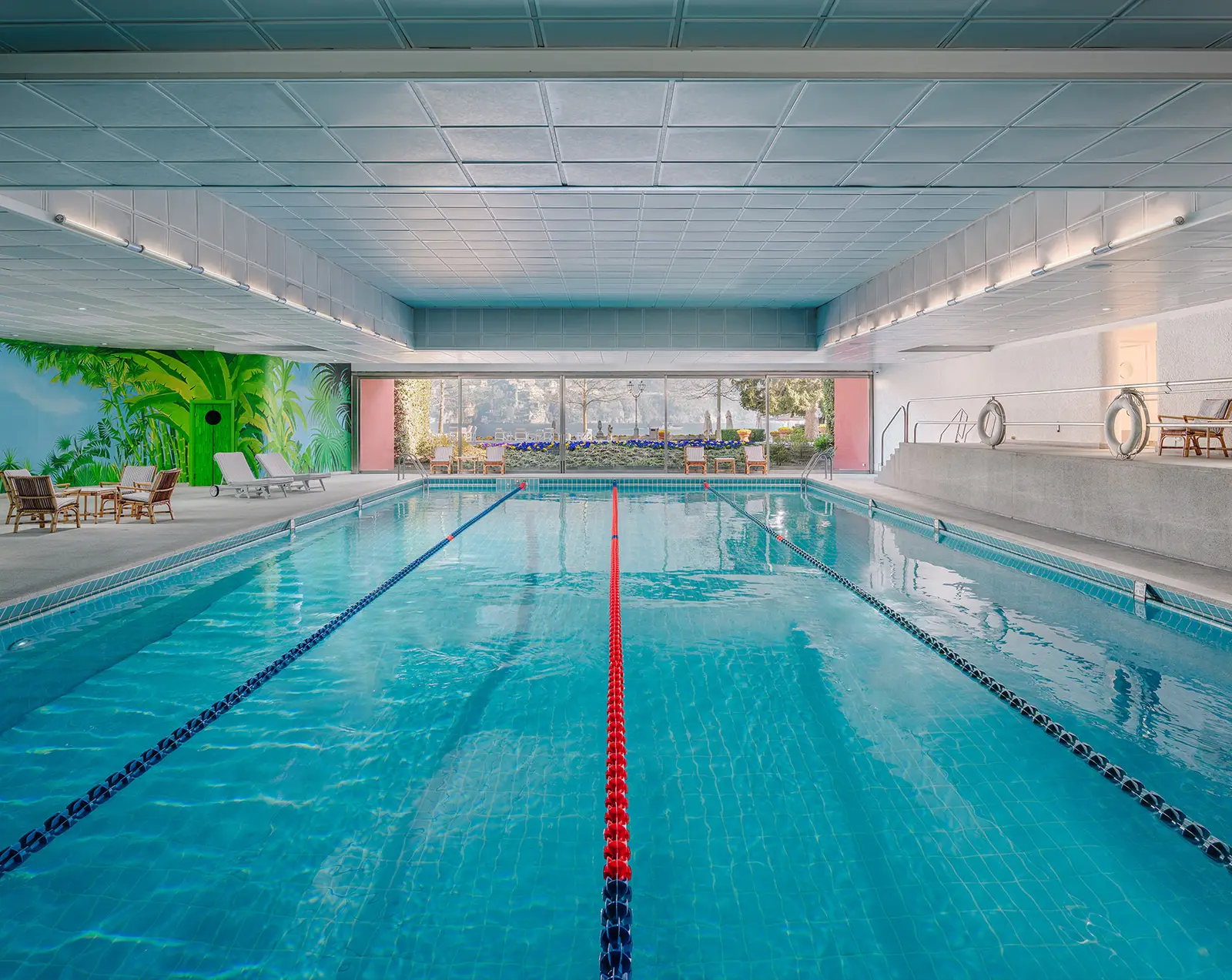 The indoor pool with lanes and a painted wall