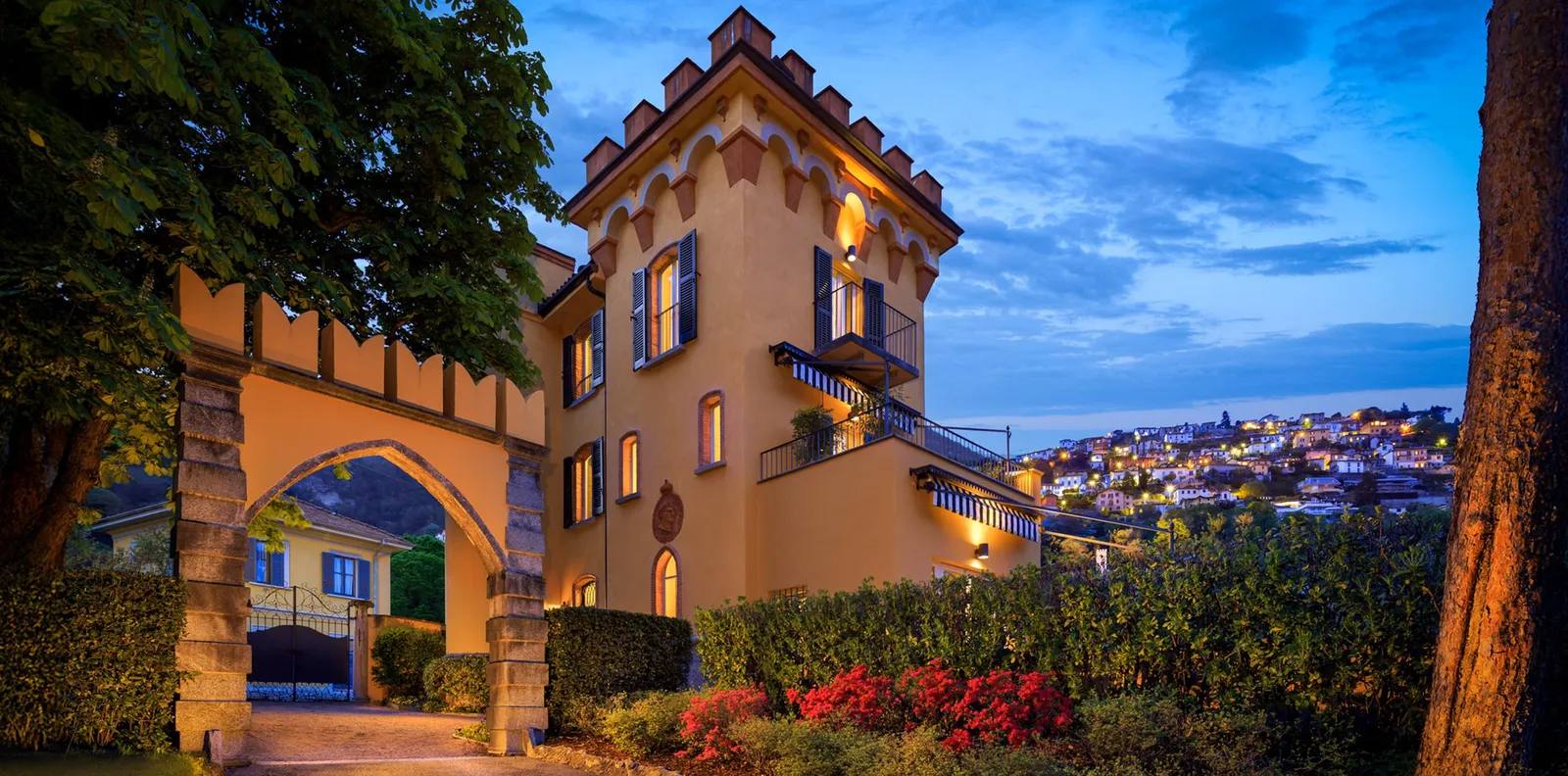 Villa Malakoff’s tower at dusk among the trees