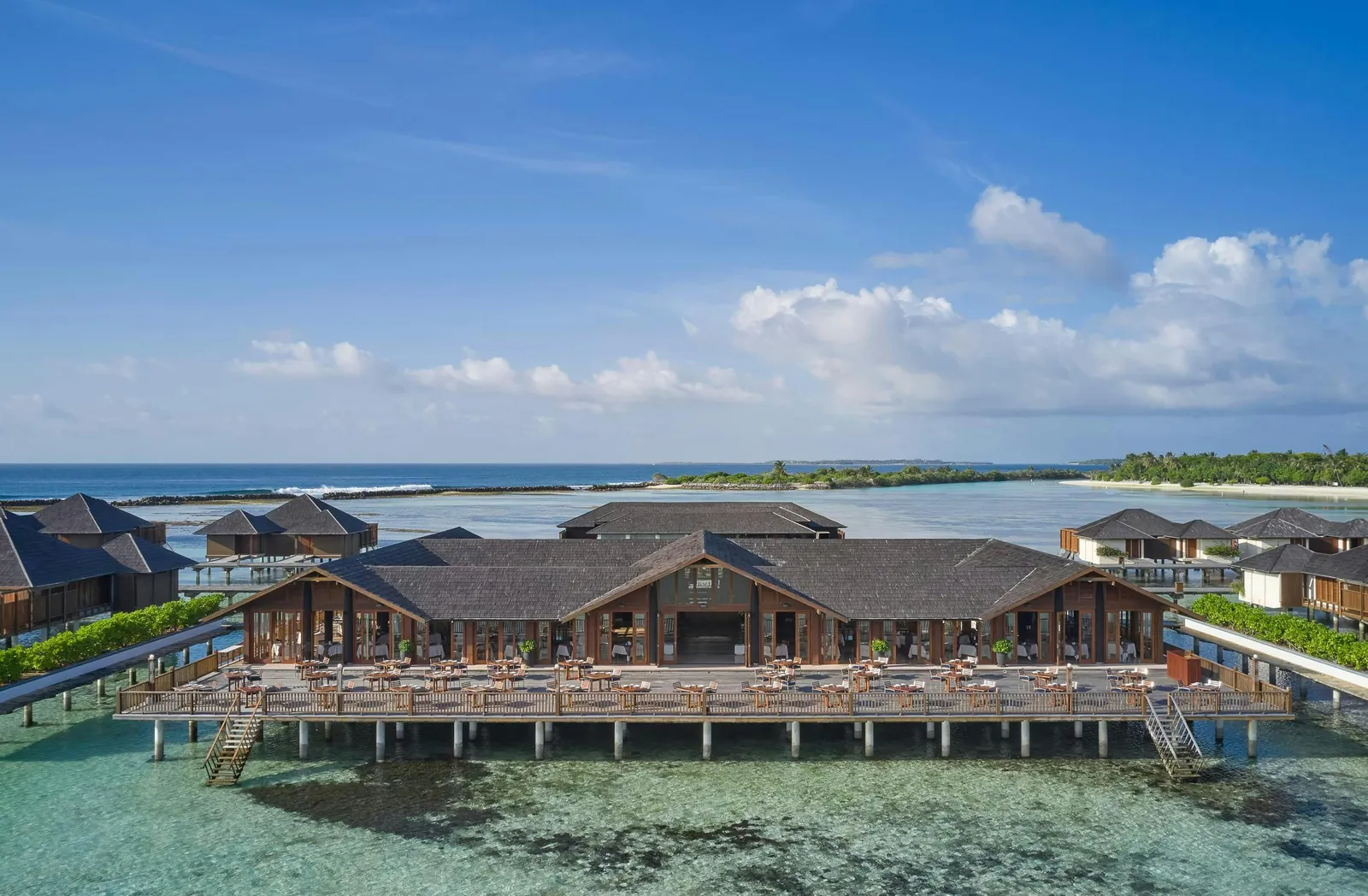 The Lagoon, the restaurant on stilts, with water villas either side and the reef beneath the surface.