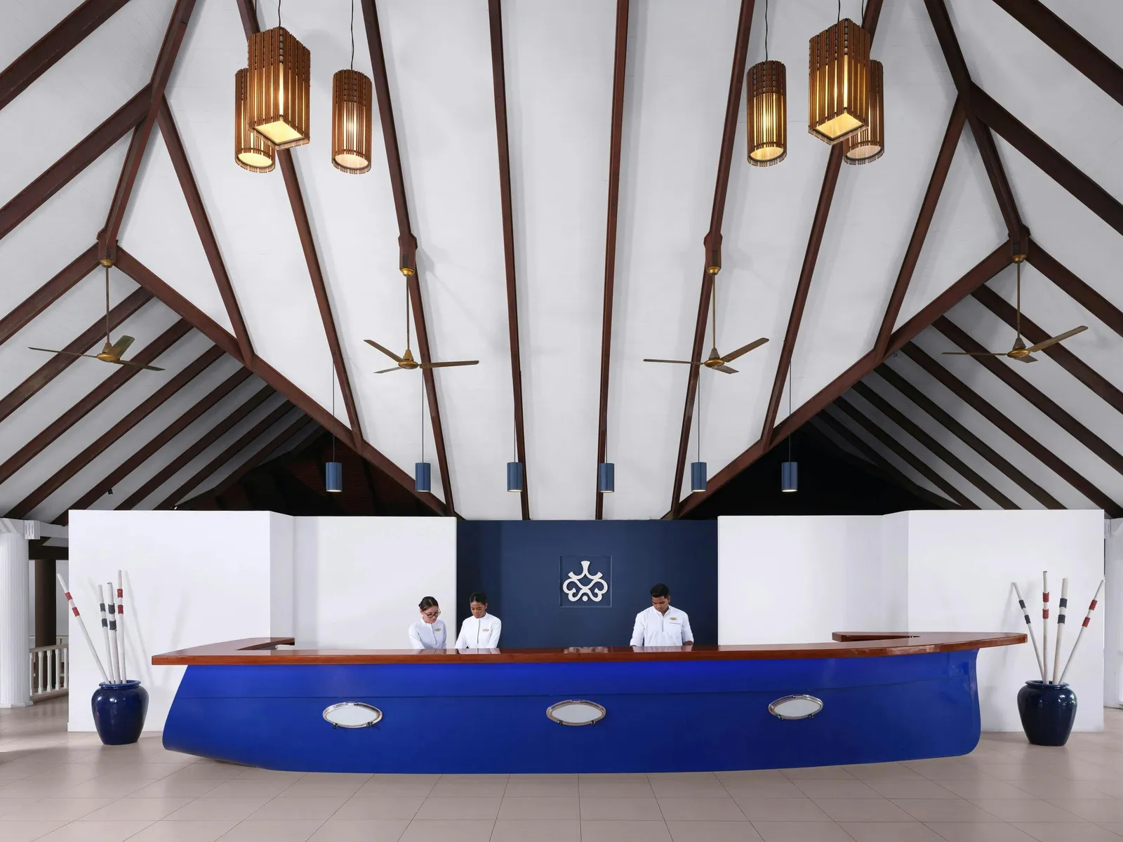 The reception under its pitched roof, the blue desk shaped like a hull with portholes.