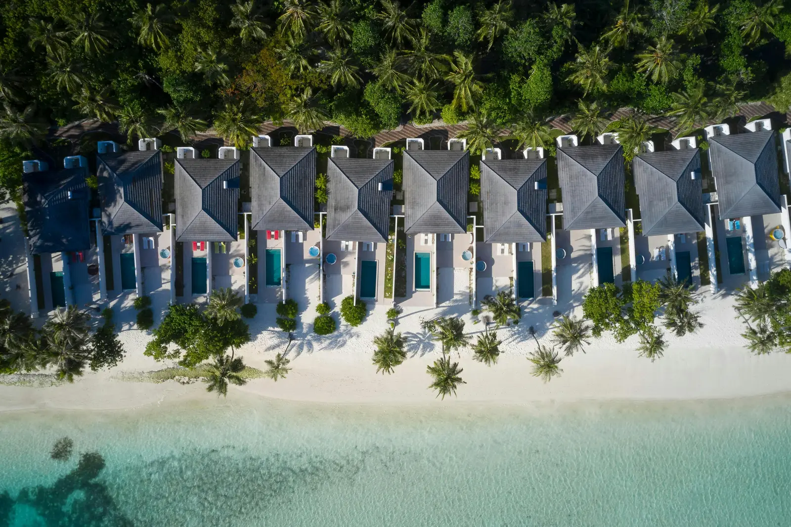 Beach villas and pools from above.