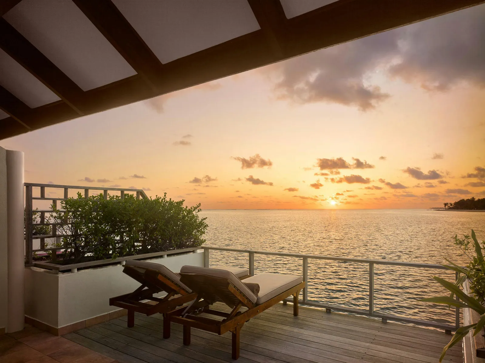 Overwater terrace at sunset.