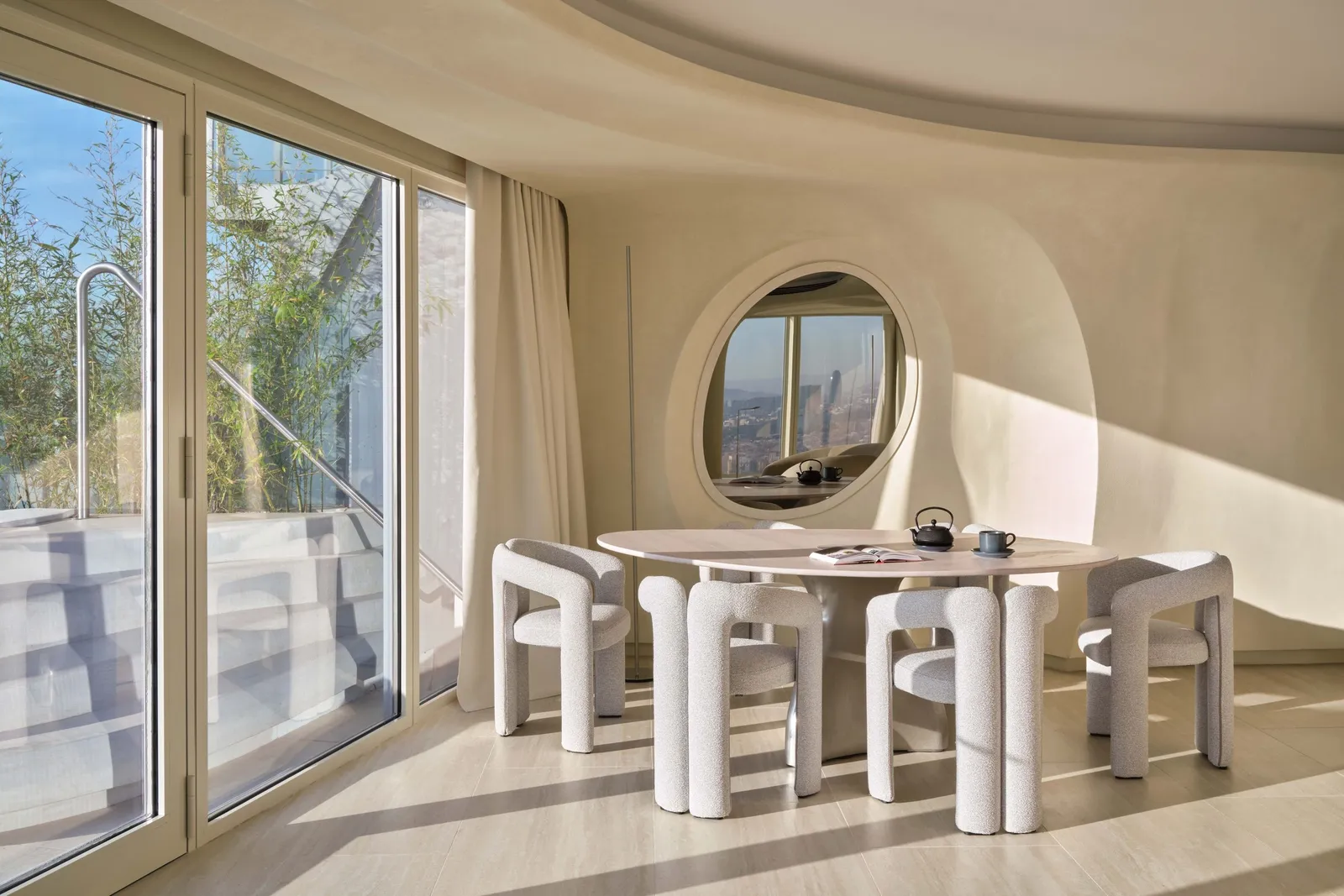 The white table of the Onada Terrace Suite by the glass and the terrace