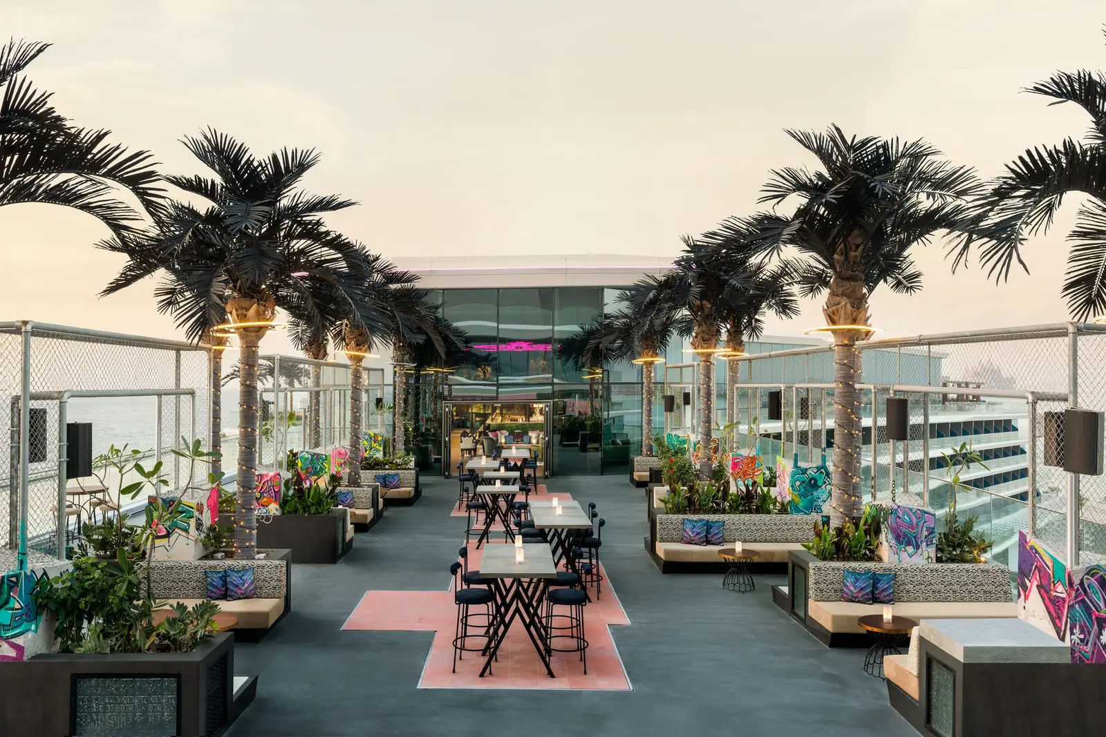 SoBe’s terrace with palms, tables and towers