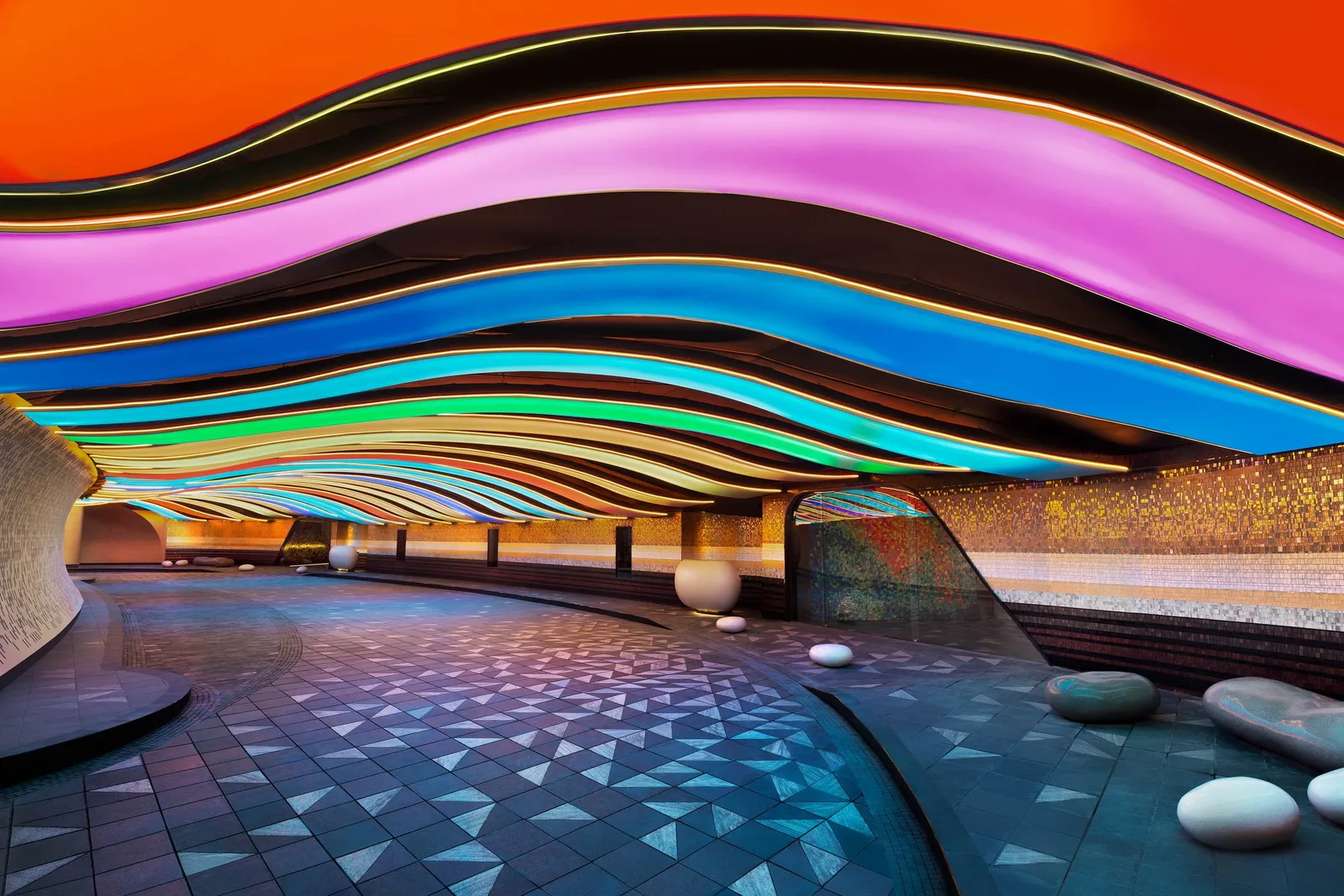 The car arrival under the wave-shaped coloured ceiling