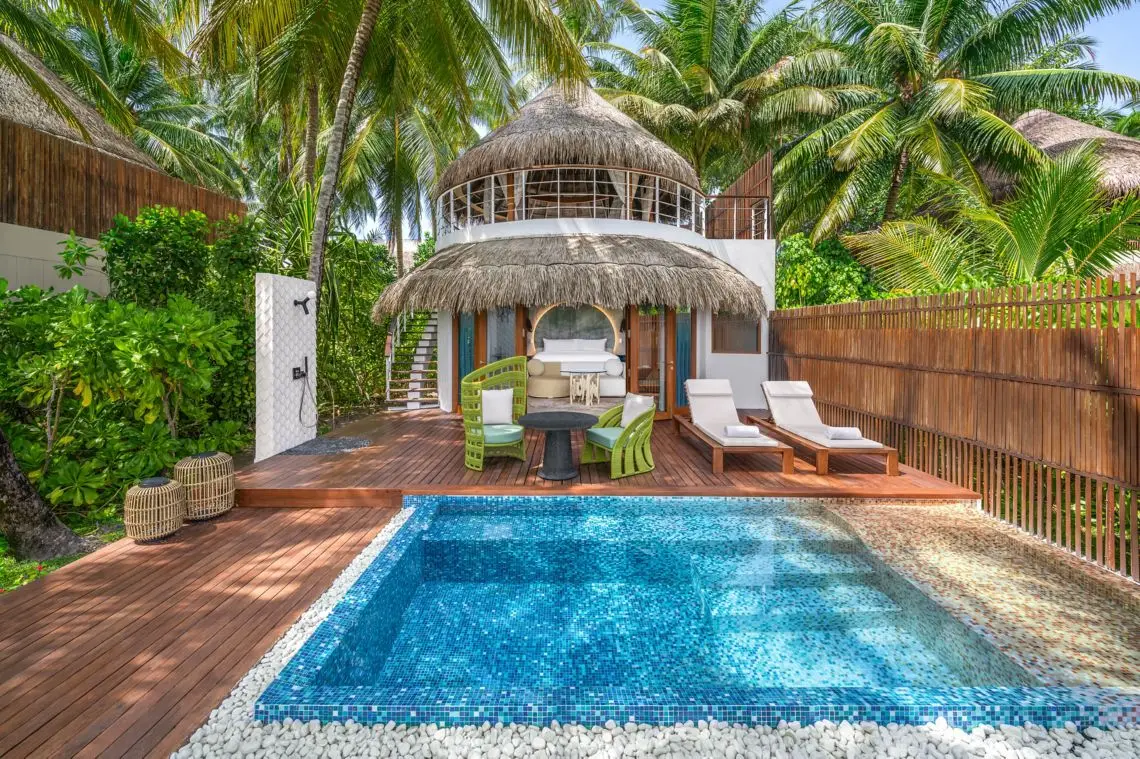 A 2-level Escape Beach villa with a private pool among palms