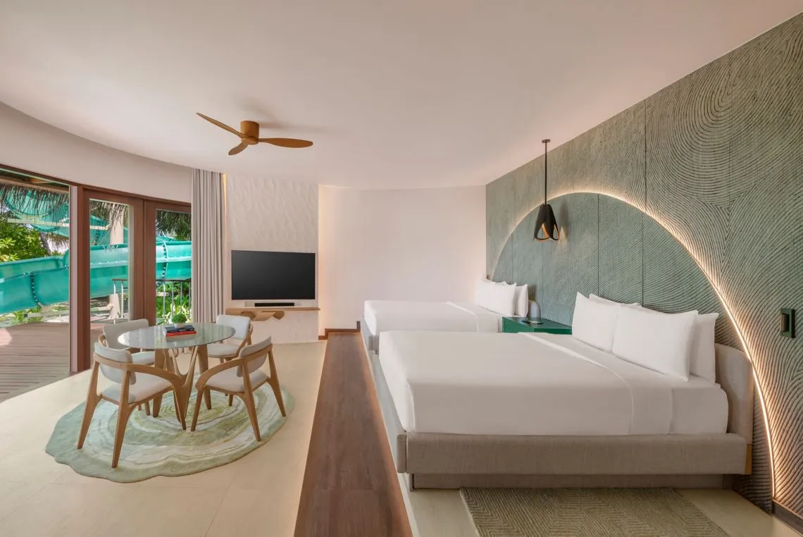An Oasis Beach bedroom with 2 beds and the slide visible outside