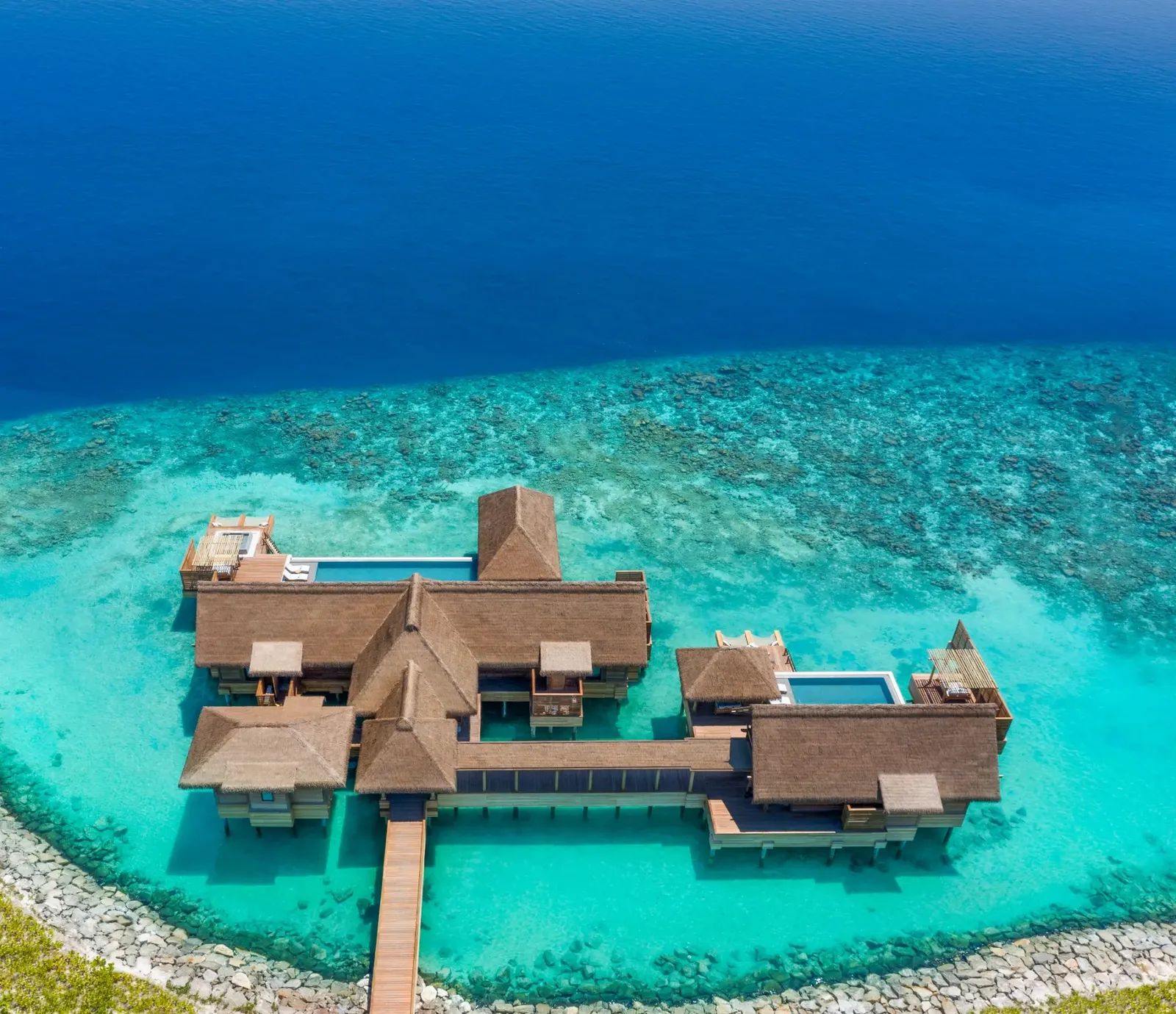 The Three Bedroom Overwater Villa on open water, beyond the reef
