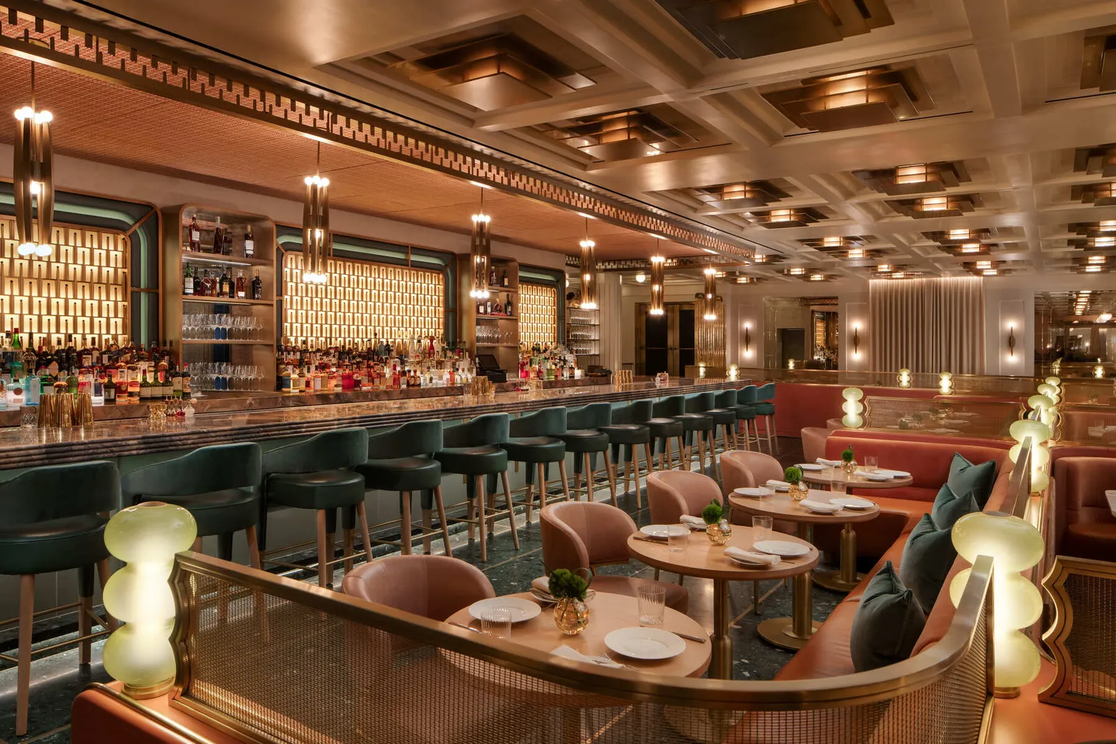 Lex Yard’s Bar Room, the pink banquettes and the long bar under the coffered ceiling