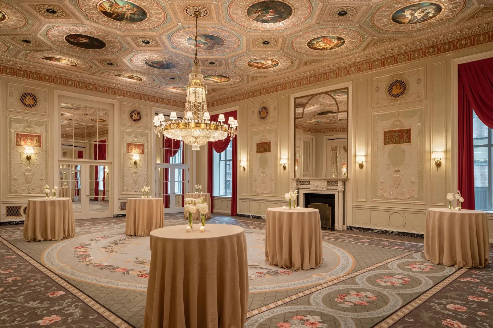 A restored salon with its painted ceiling, set for an event