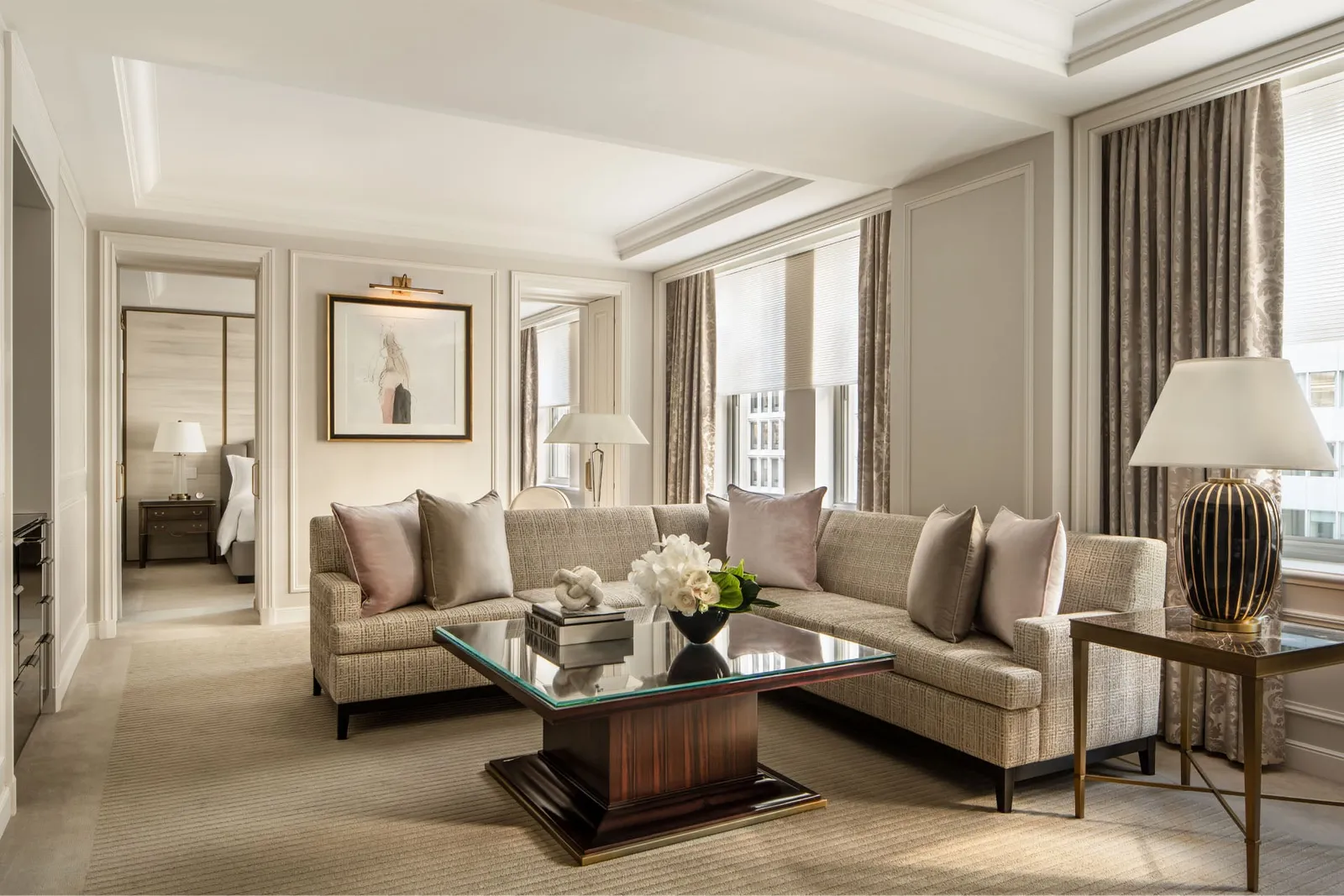 The One Bedroom Suite living room, its pale sofas and dark coffee table