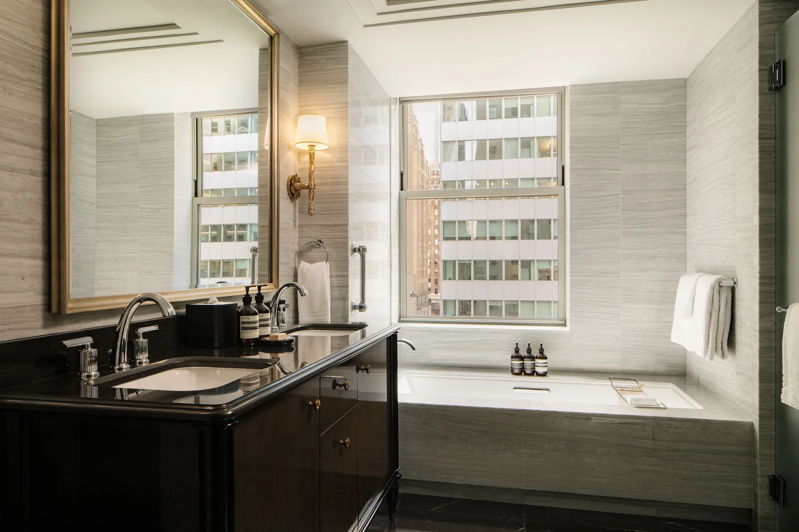 The Premier One Bedroom Suite bathroom, the tub under the window