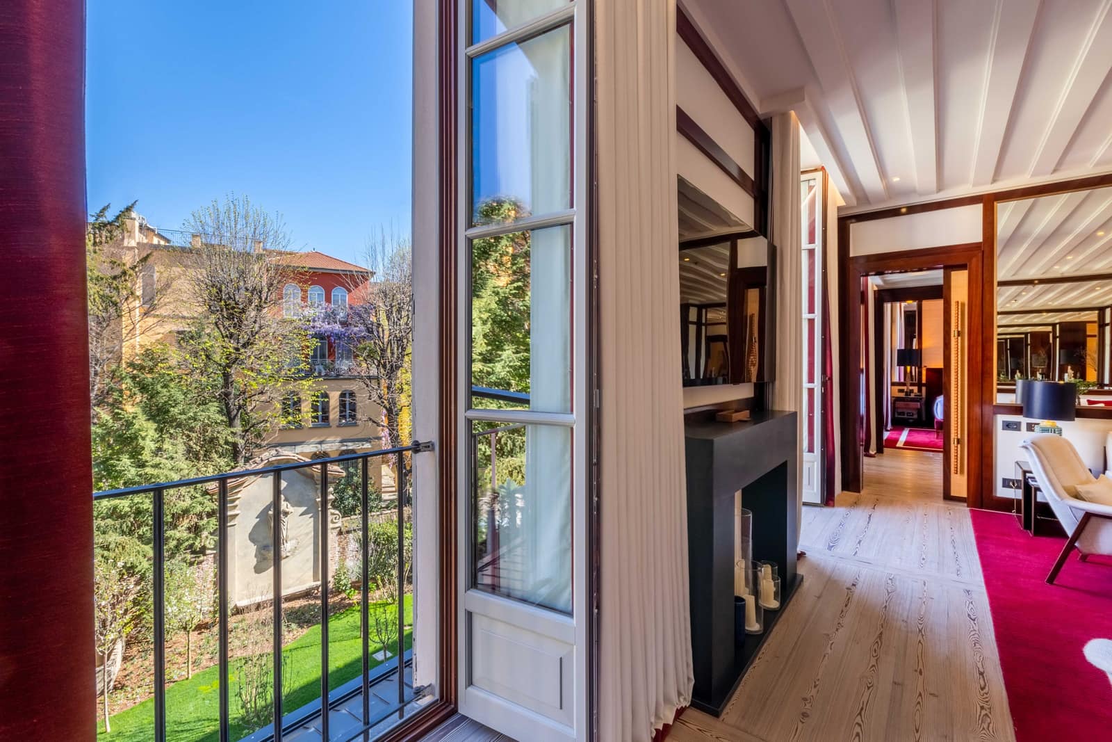 A quiet garden-facing suite at Portrait Milano