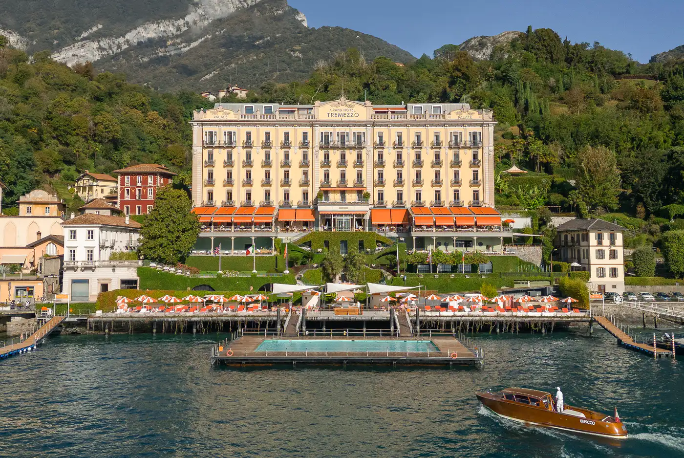 Grand Hotel Tremezzo from the lake, with its floating pool and a motorboat