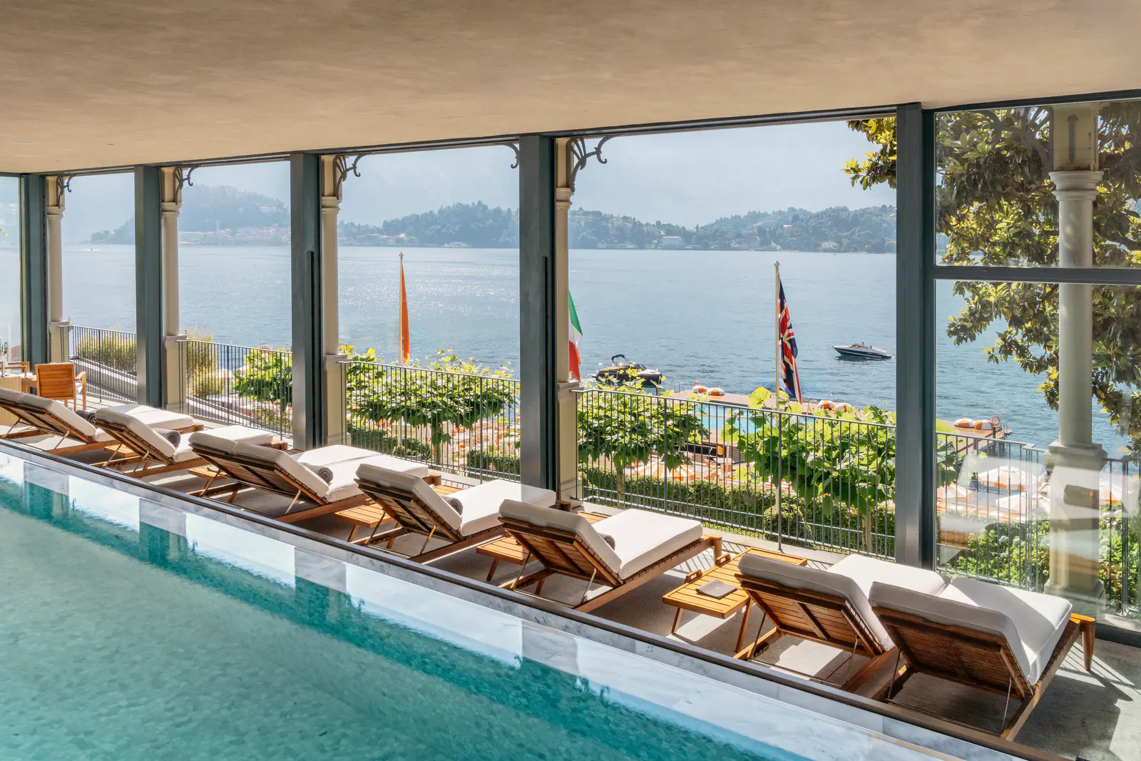 T Spa infinity pool with glass doors opening towards the lake